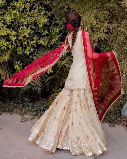 Traditional Ivory Sharara Suit with Embroidered Red Dupatta